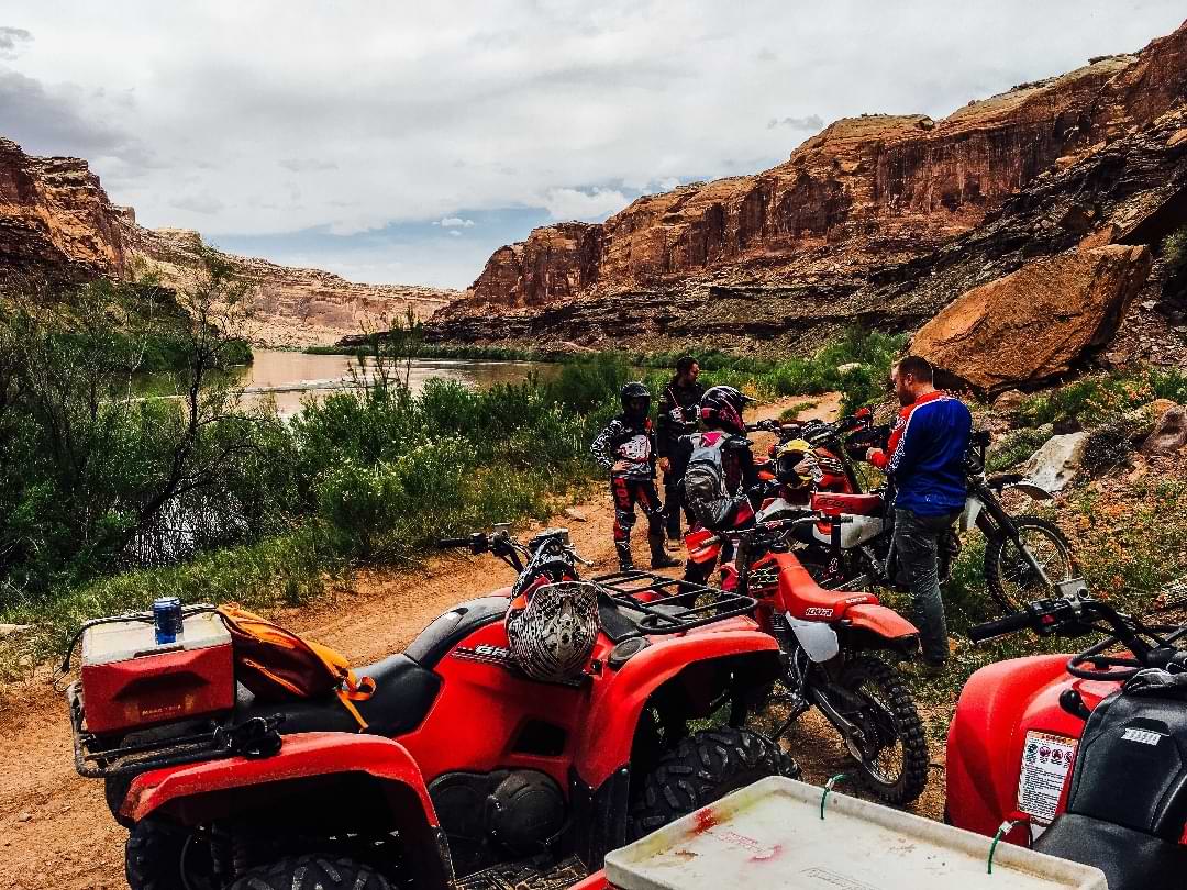 Group of ATVs and dirt bikes by Colorado River canyon in Utah