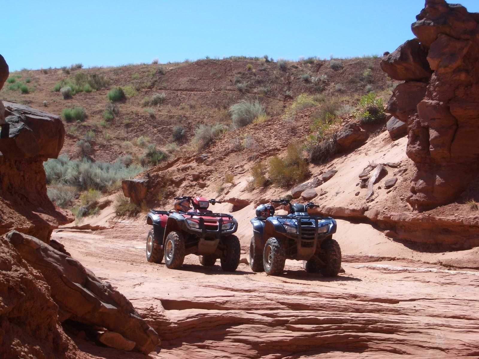 ATVs riding through red rock canyon in Utah