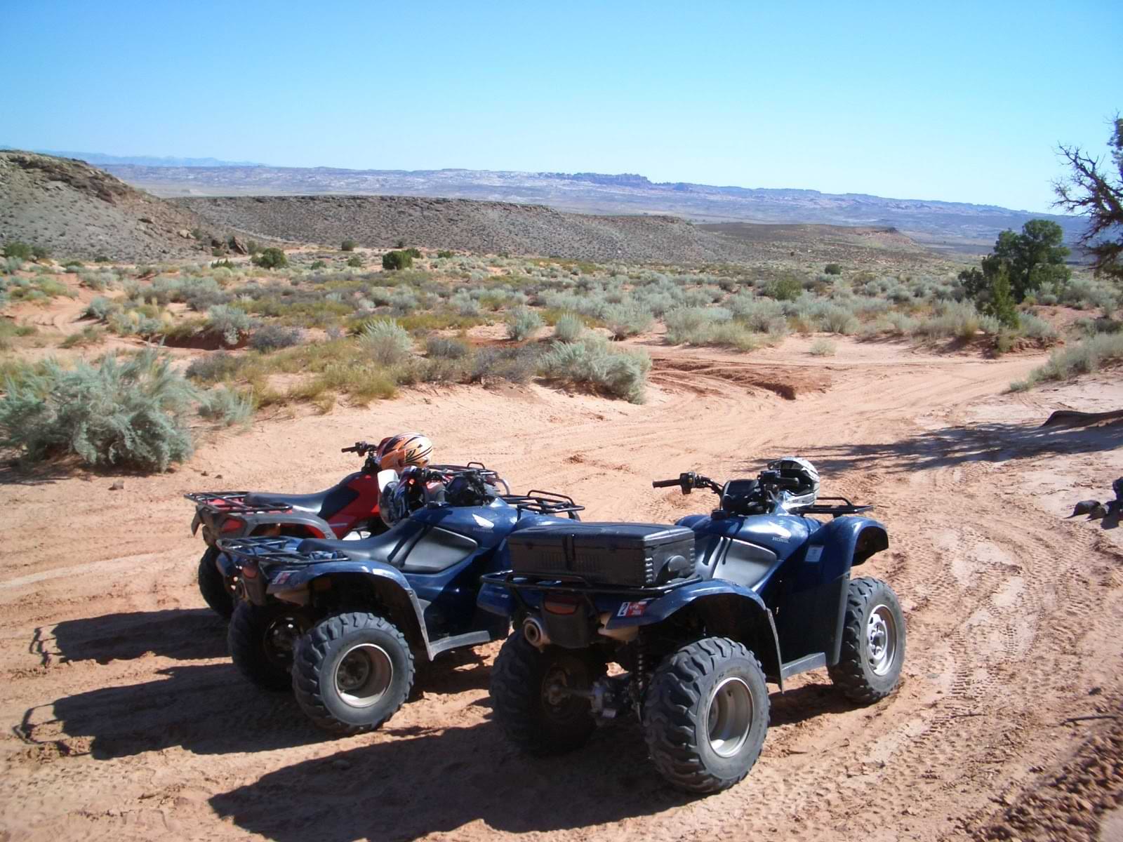 ATVs parked on sandy desert trail in Utah