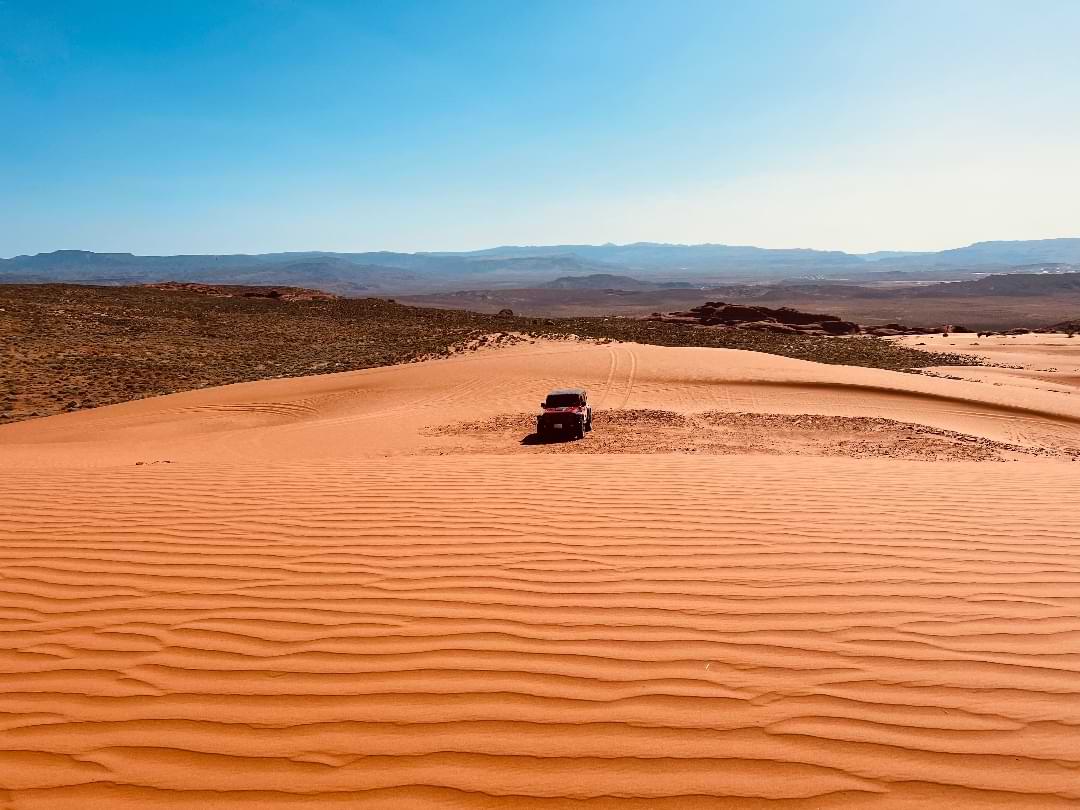Jeep Wrangler in Utah sand dunes