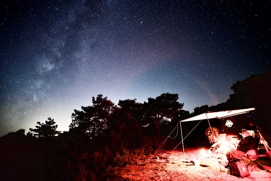Campsite under the Milky Way night sky