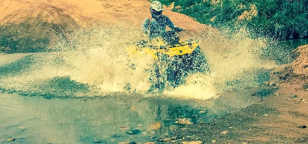 ATV splashing through desert water