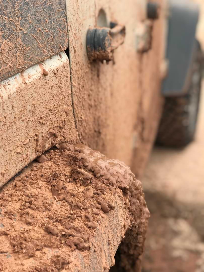 Close-up of muddy offroad Jeep in the Southwest